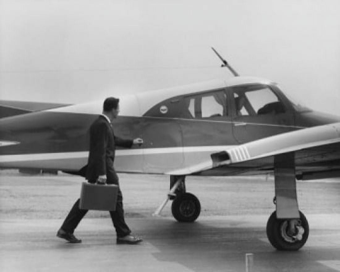 Side profile of a businessman boarding an airplane Canvas Art - (24 x 36)