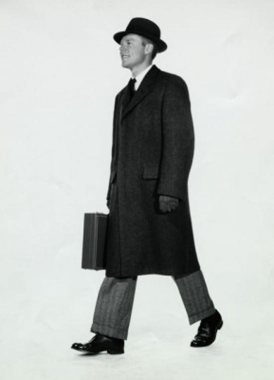 Side profile of a businessman carrying a briefcase Canvas Art - (24 x 36)