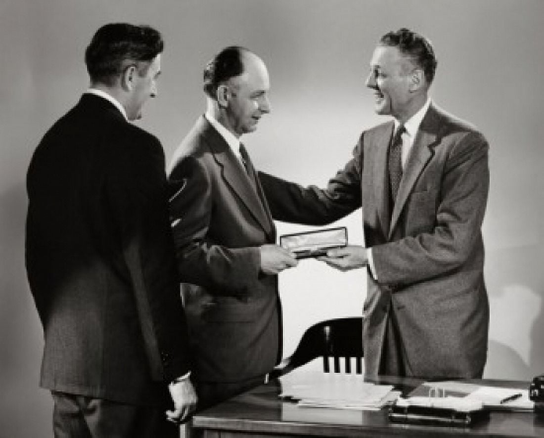 Side profile of a businessman presenting a gift to another businessman Canvas Art - (18 x 24)