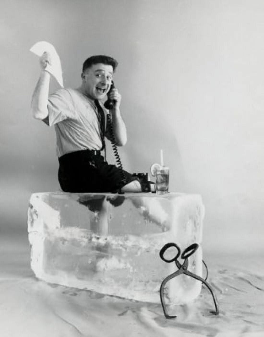Side profile of a businessman sitting on ice using a telephone Canvas Art - (18 x 24)