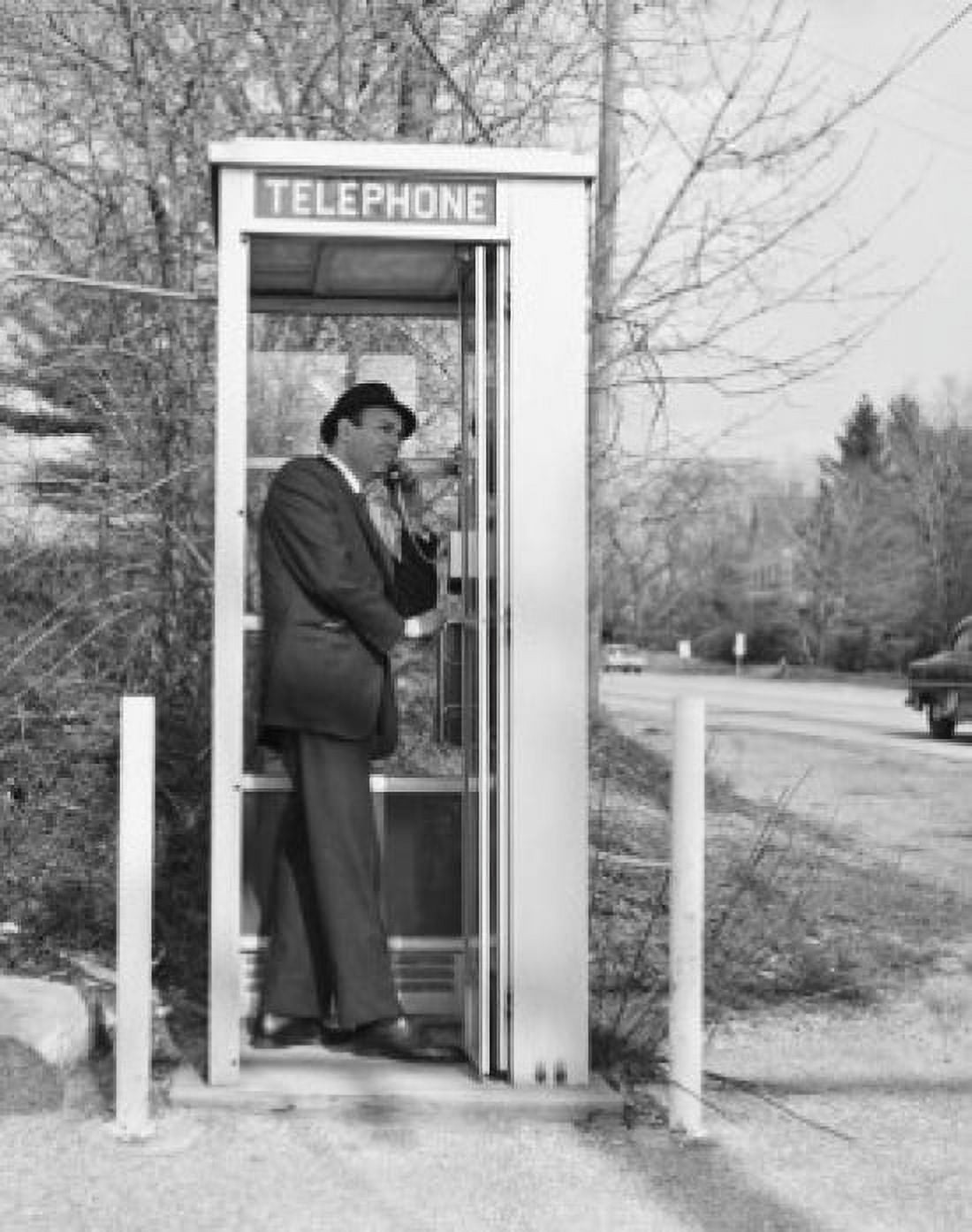 Side profile of a businessman talking on a pay phone Canvas Art - (18 x 24)