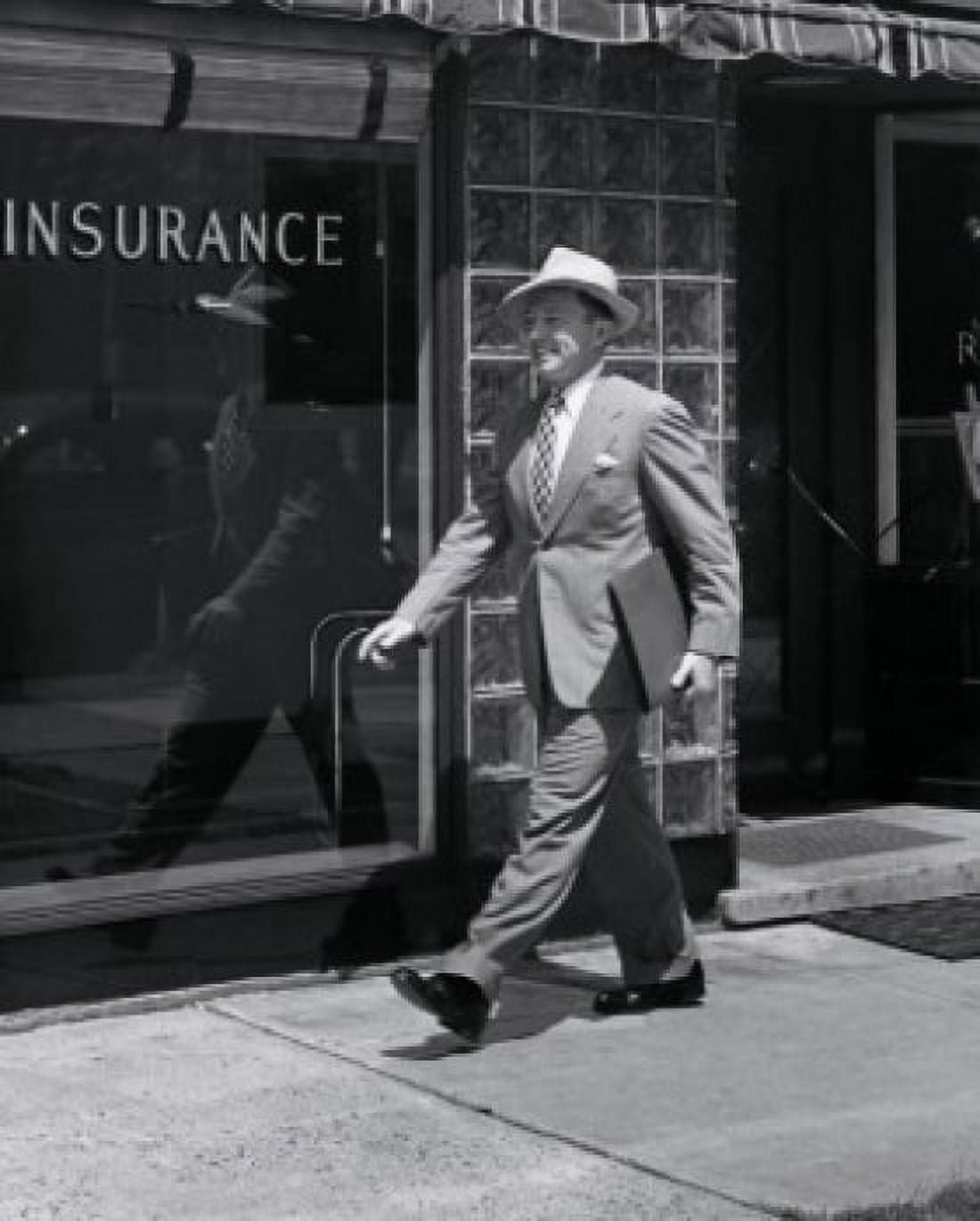 Side profile of a businessman walking with a portfolio Canvas Art - (24 x 36)