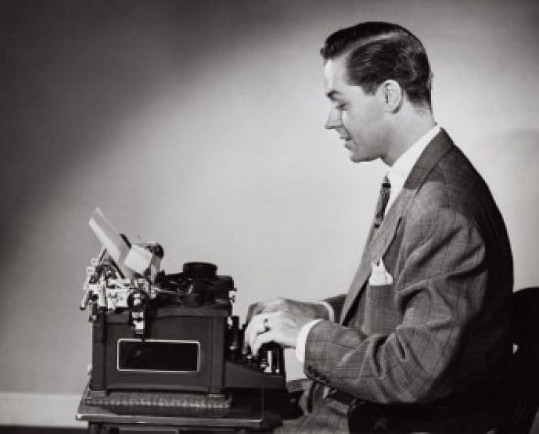 Side profile of a businessman working on a typewriter Canvas Art - (24 x 36)