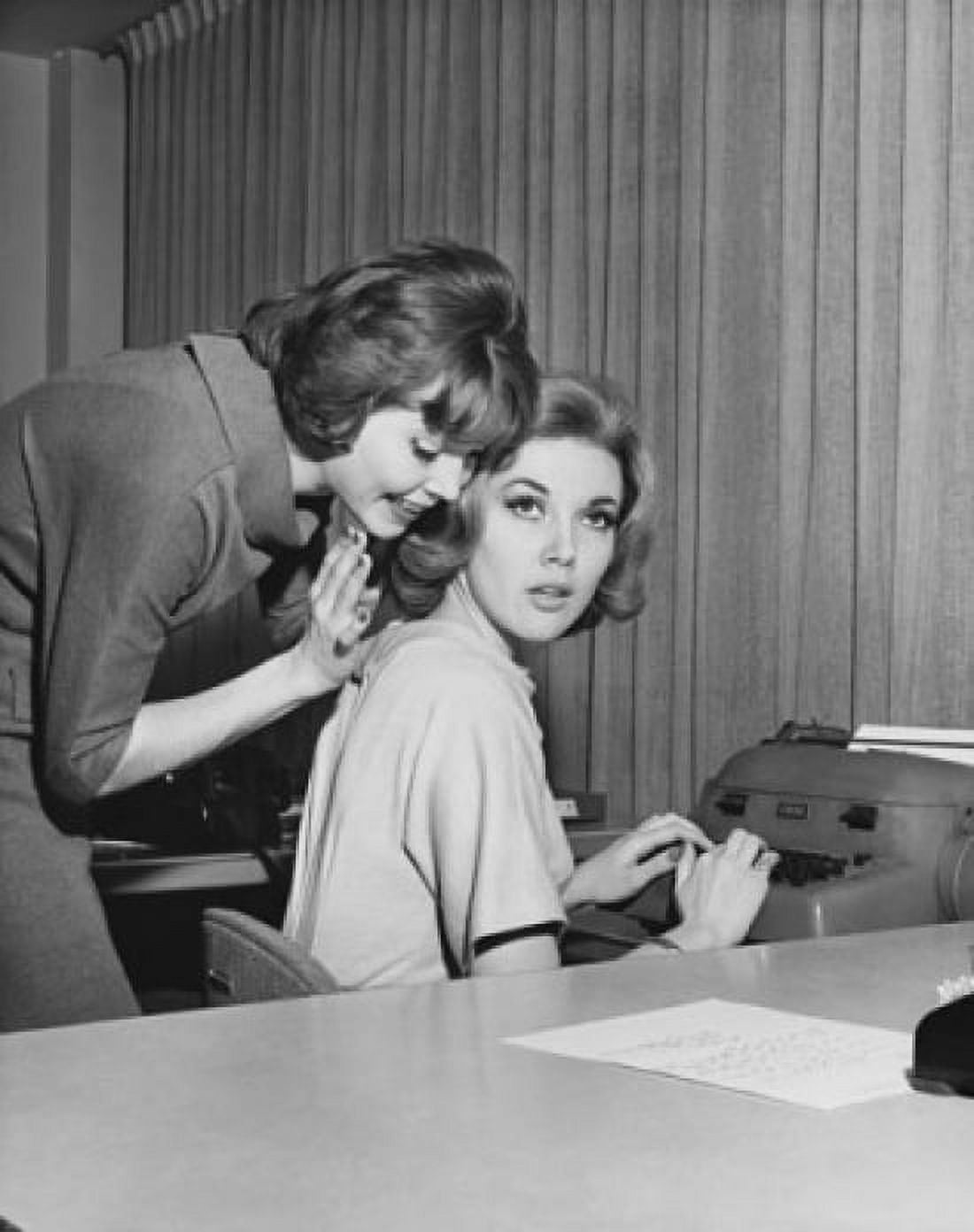 Side profile of a businesswoman whispering to another businesswoman in an office Canvas Art - (18 x 24)