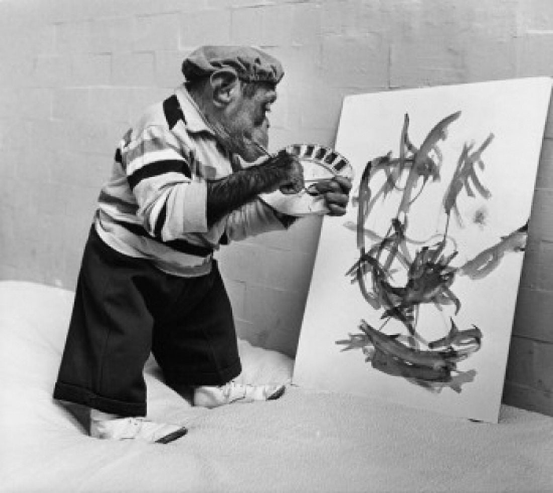 Side profile of a chimpanzee holding a paintbrush and a palette Canvas Art - (18 x 24)