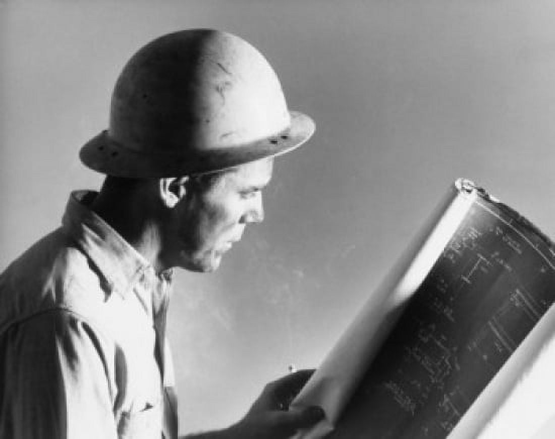 Side profile of a construction worker holding a blueprint Canvas Art - (24 x 36)
