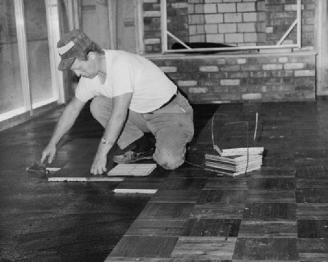 Side profile of a construction worker laying wooden flooring Canvas Art - (18 x 24)