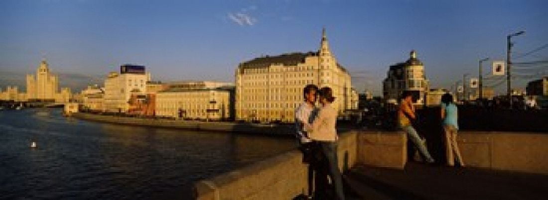 Side profile of a couple romancing Moskva River Moscow Russia Canvas Art - Panoramic Images (36 x 13)
