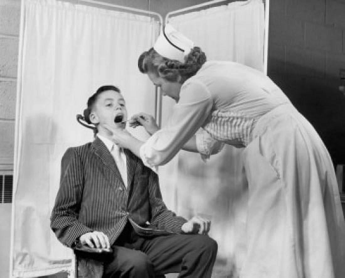Side profile of a female nurse examining a boys throat Canvas Art - (18 x 24)