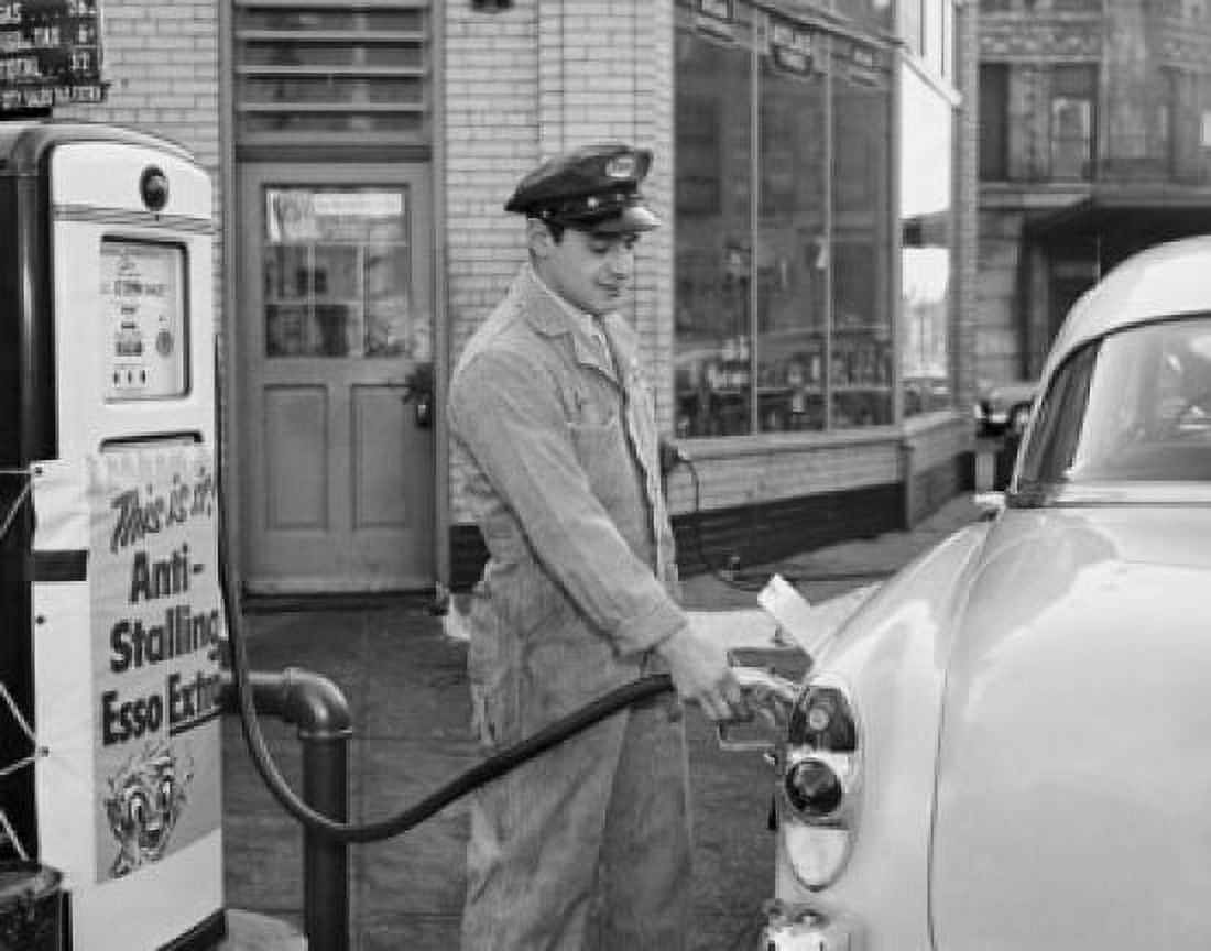 Side profile of a gas station attendant filling up a car Canvas Art - (24 x 36)