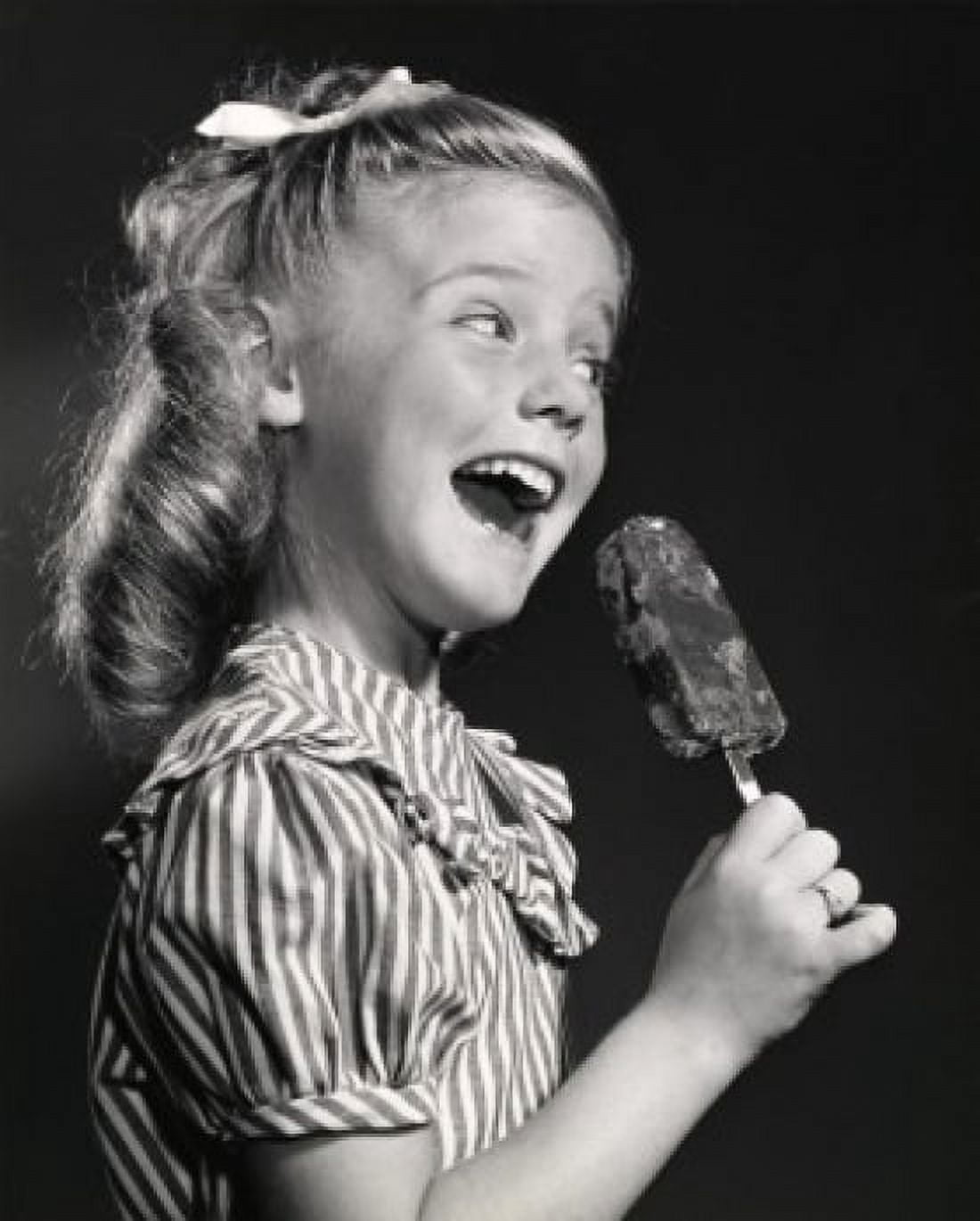 Side profile of a girl holding an ice-cream Canvas Art - (18 x 24)