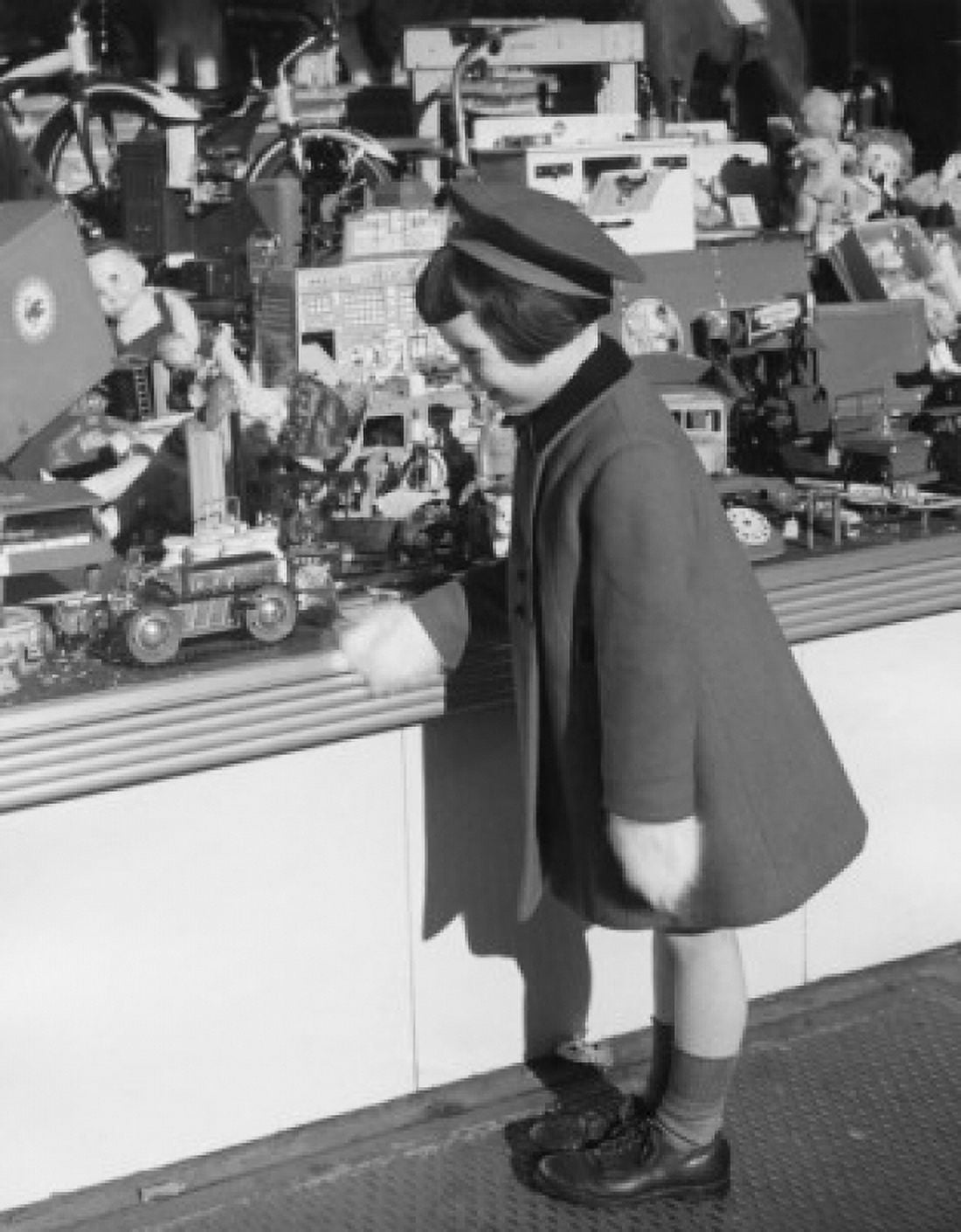 Side profile of a girl looking at toys in the display window of a toy store Canvas Art - (24 x 36)