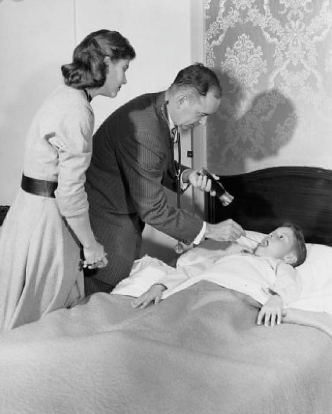 Side profile of a male pediatrician examining a boys throat Canvas Art - (24 x 36)