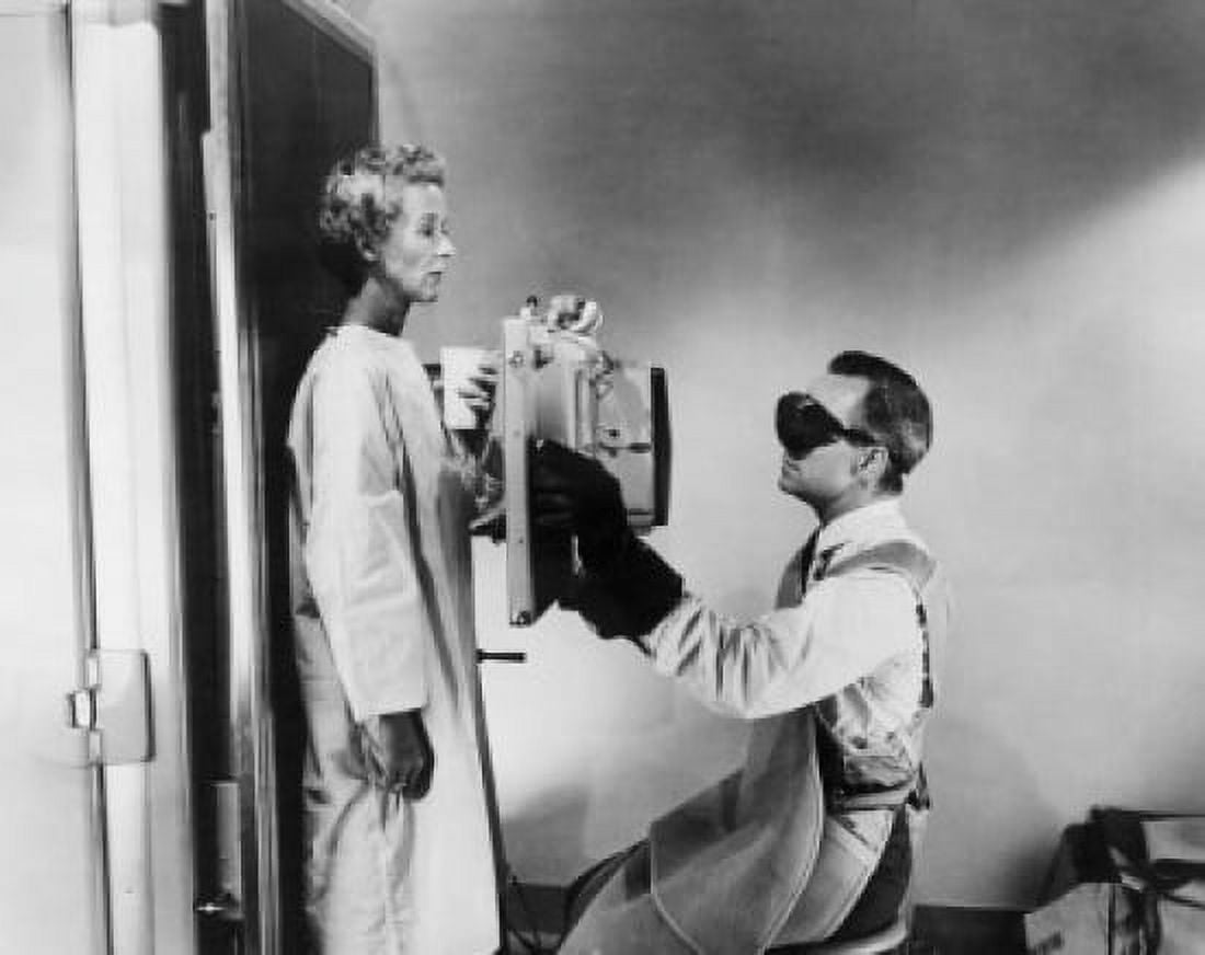 Side profile of a male radiologist taking an x-ray of a female patient Canvas Art - (18 x 24)