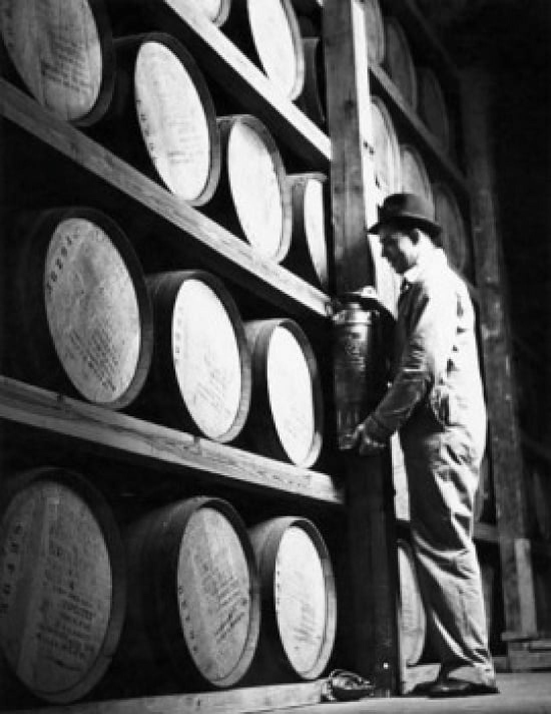 Side profile of a male worker standing in front of barrels in a whisky storage room Louisville Kentucky USA Canvas Art - (24 x 36)