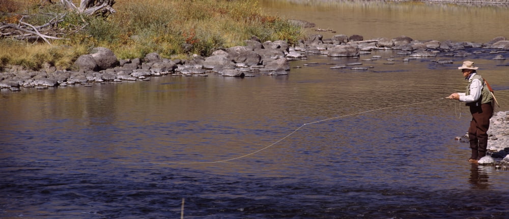 Side profile of a man fishing Slough Creek Lamar Valley Yellowstone National Park Wyoming USA Canvas Art - Panoramic Images (36 x 12)