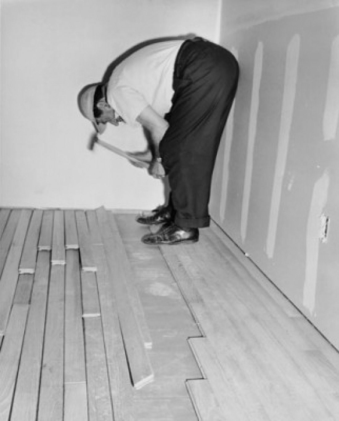 Side profile of a man laying a hardwood floor Canvas Art - (18 x 24)