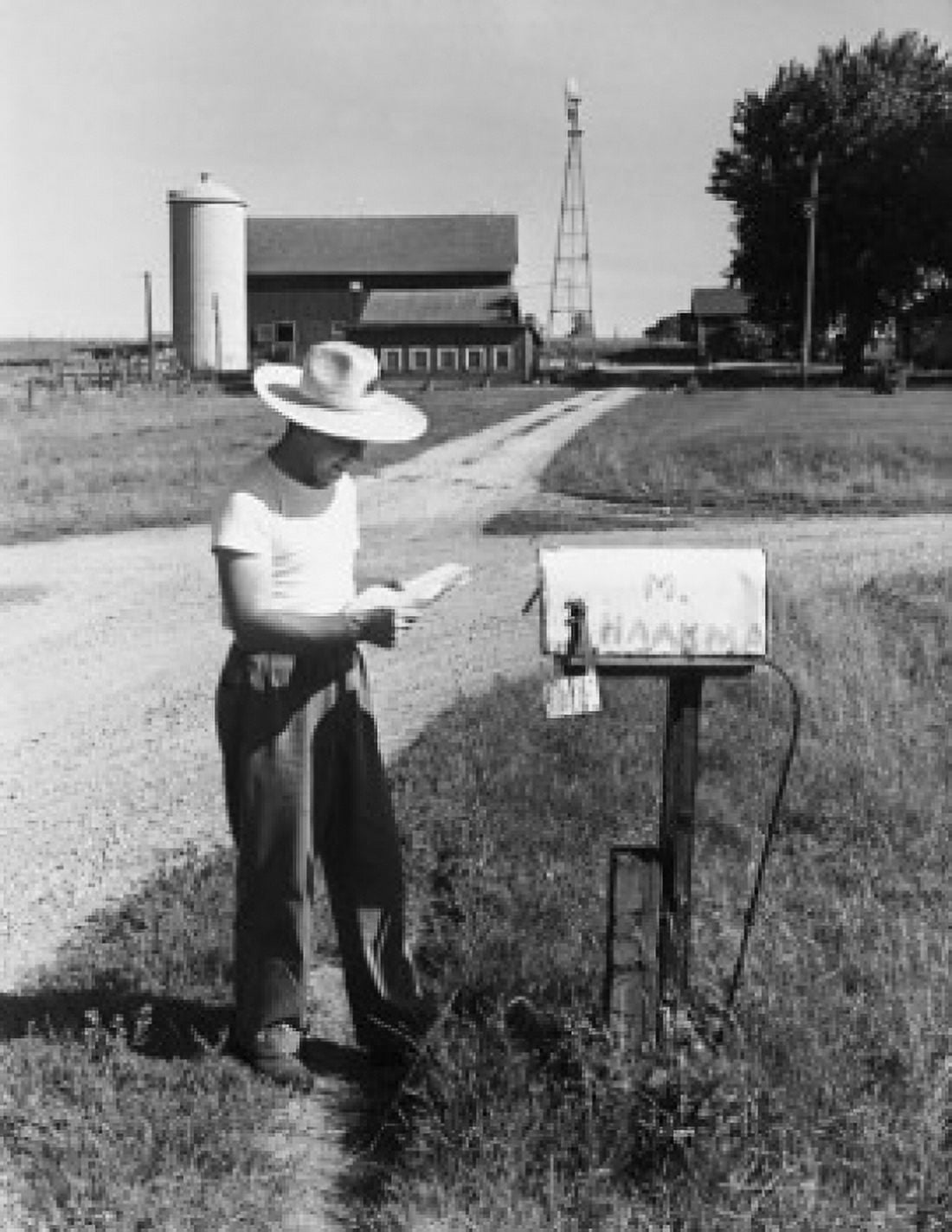 Side profile of a man reading mail in front of a mailbox Randolph Wisconsin USA Canvas Art -  (18 x 24)