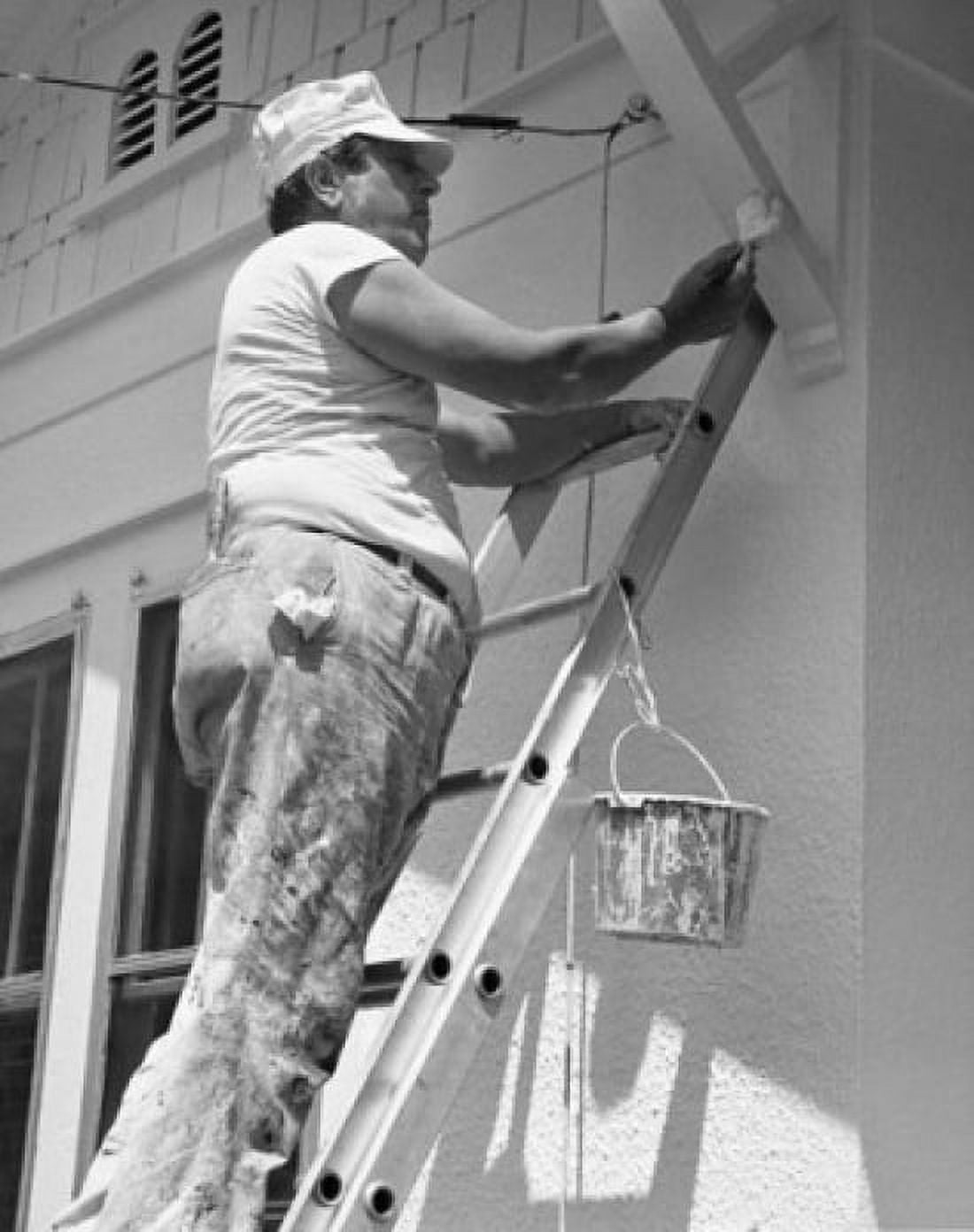 Side profile of a mature man standing on a ladder and painting a building Canvas Art - (18 x 24)