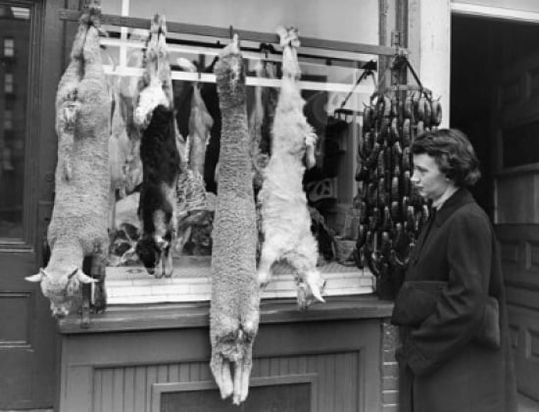 Side profile of a mature woman standing at a butcher shop Canvas Art - (24 x 36)