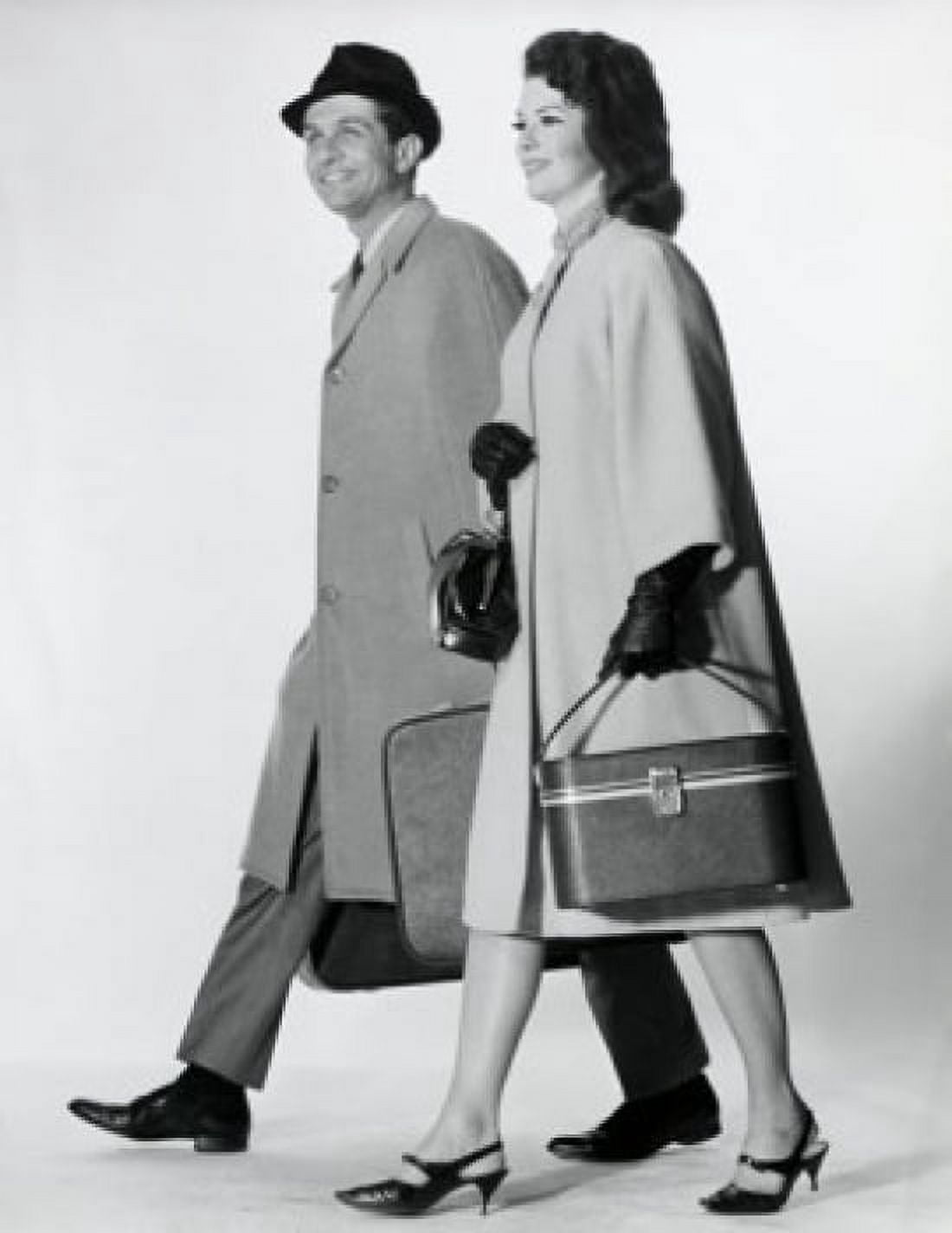 Side profile of a mid adult couple walking with luggage Canvas Art - (24 x 36)