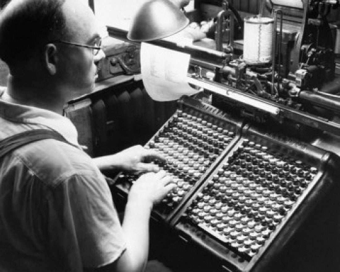 Side profile of a mid adult man operating a monotype machine Canvas Art - (24 x 36)