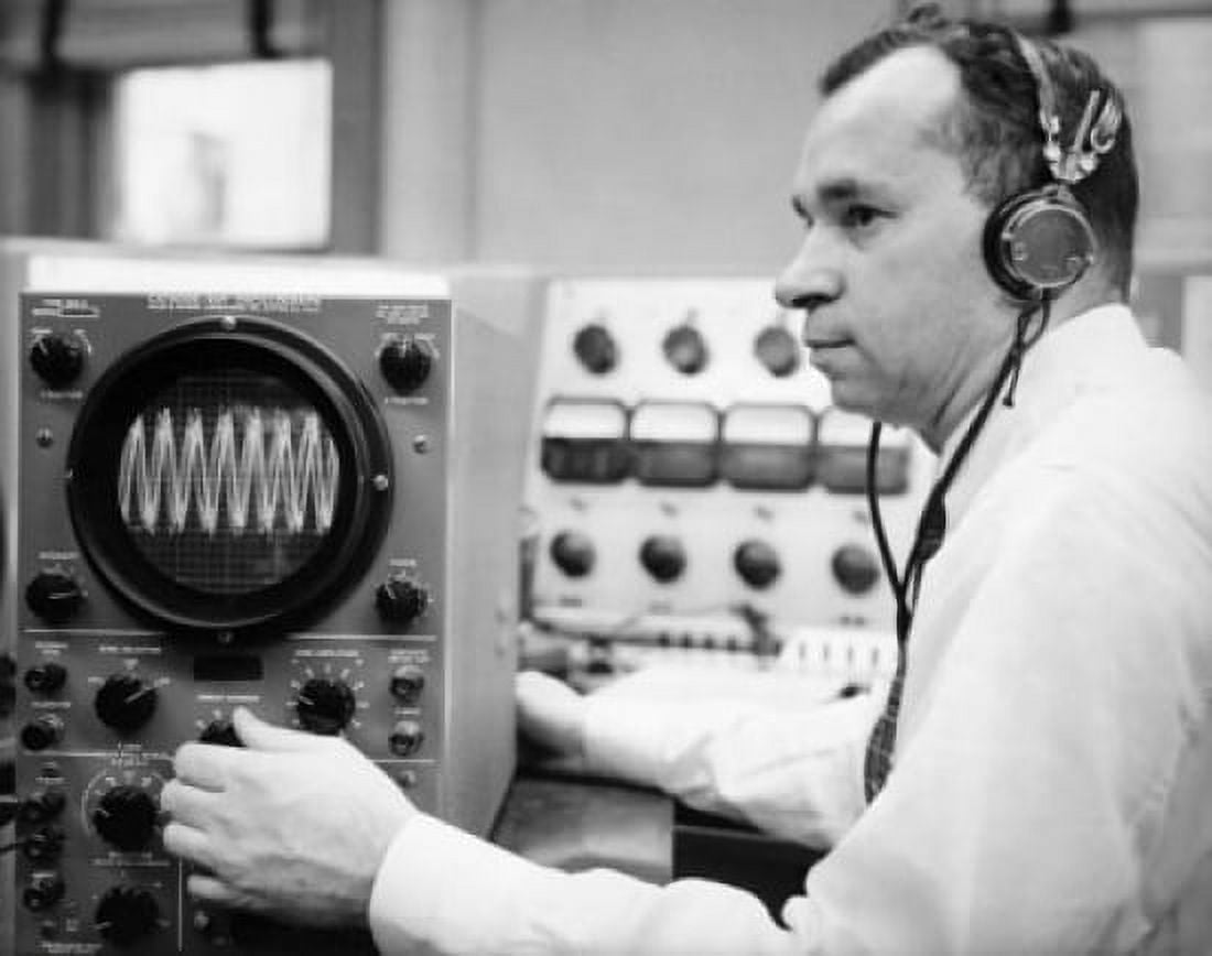 Side profile of a mid adult man operating an oscillograph Canvas Art - (18 x 24)