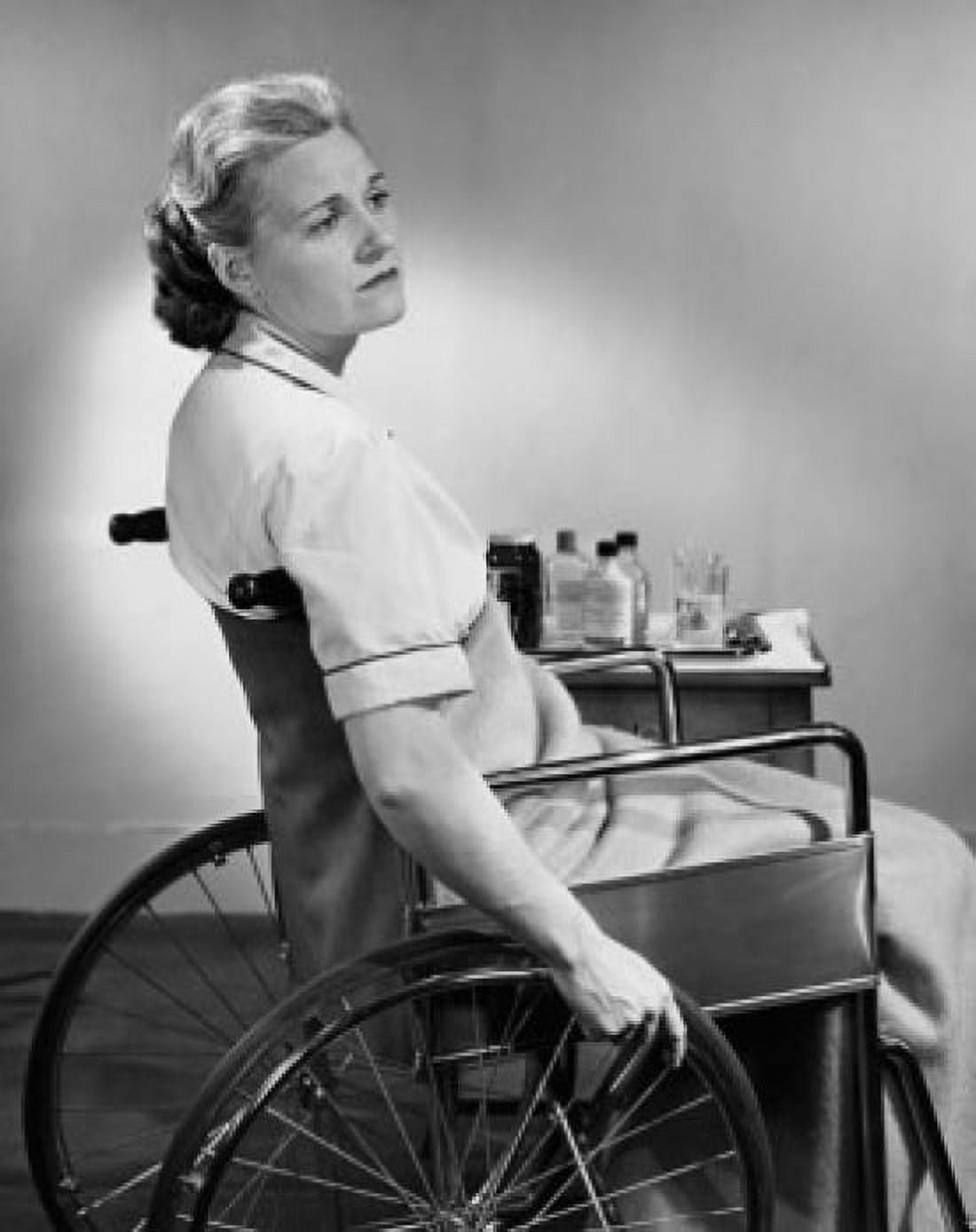 Side profile of a mid adult woman sitting on a wheelchair Canvas Art - (18 x 24)