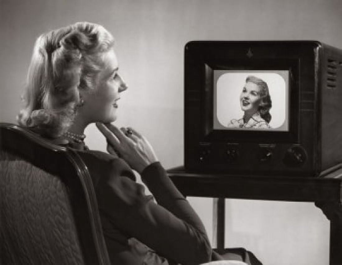 Side profile of a mid adult woman watching television Canvas Art - (24 x 36)