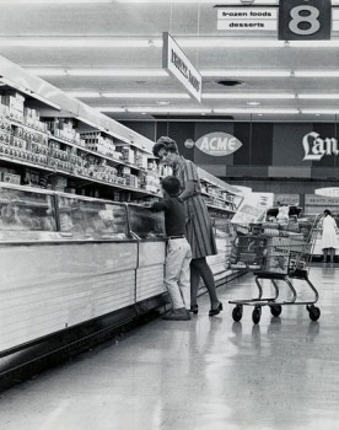 Side profile of a mother with her son shopping in a grocery store Canvas Art - (24 x 36)
