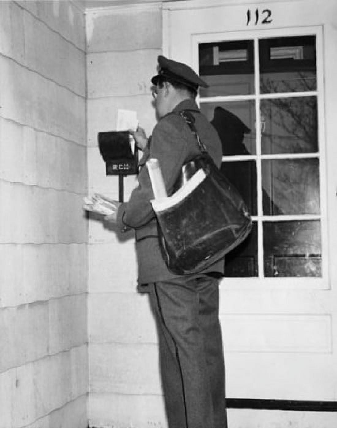 Side profile of a postman delivering mail Canvas Art - (24 x 36)