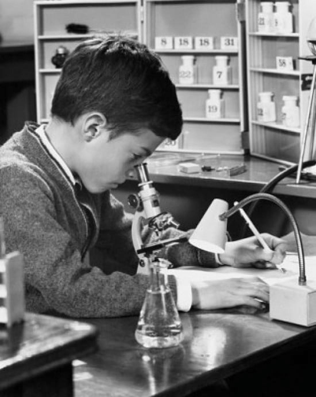 Side profile of a schoolboy looking through a microscope Canvas Art - (18 x 24)