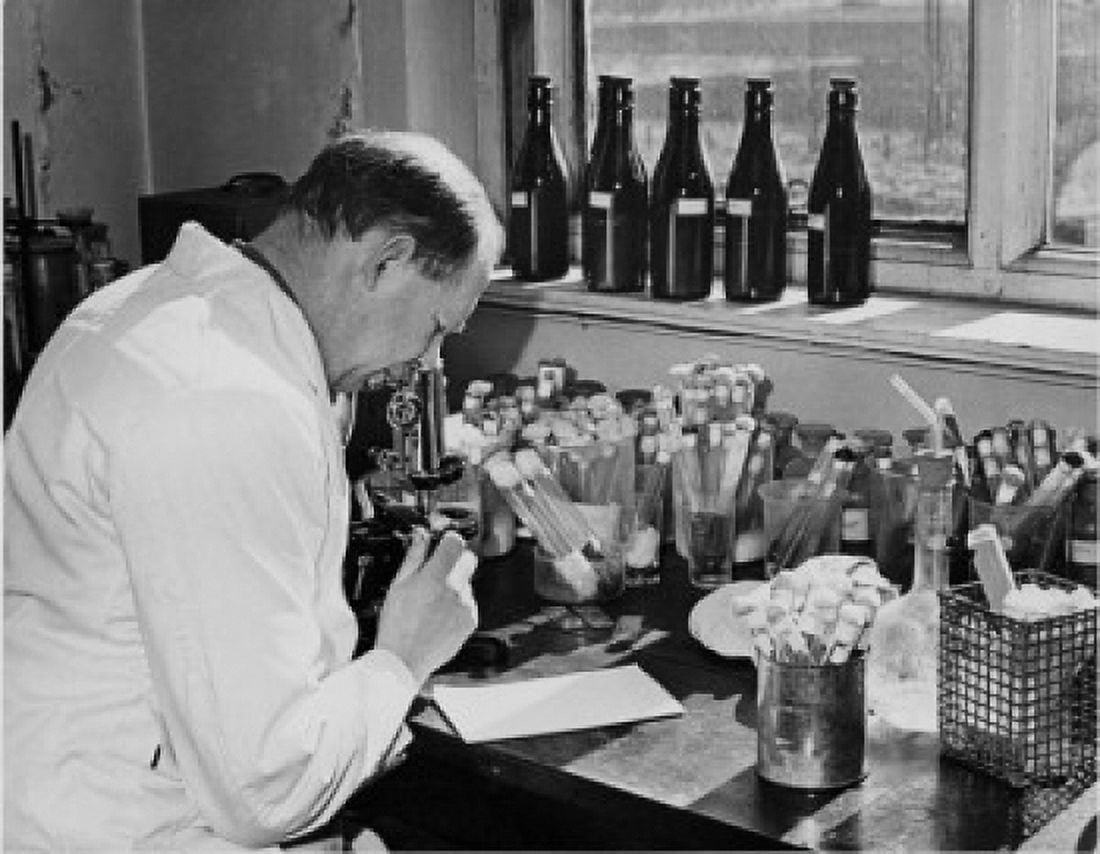 Side profile of a scientist looking through a microscope Research Station Bristol University England Canvas Art - (24 x 36)