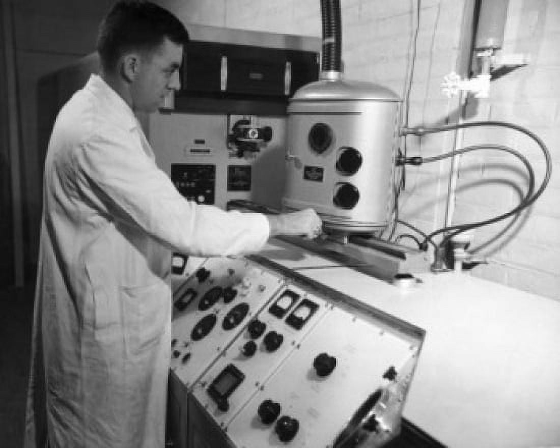 Side profile of a scientist working in the General Electric Laboratory Canvas Art -  (24 x 36)