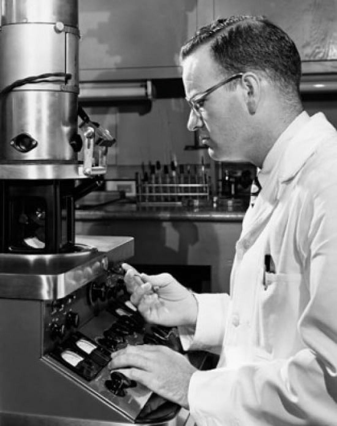 Side profile of a scientist working on an electron microscope Canvas Art - (18 x 24)
