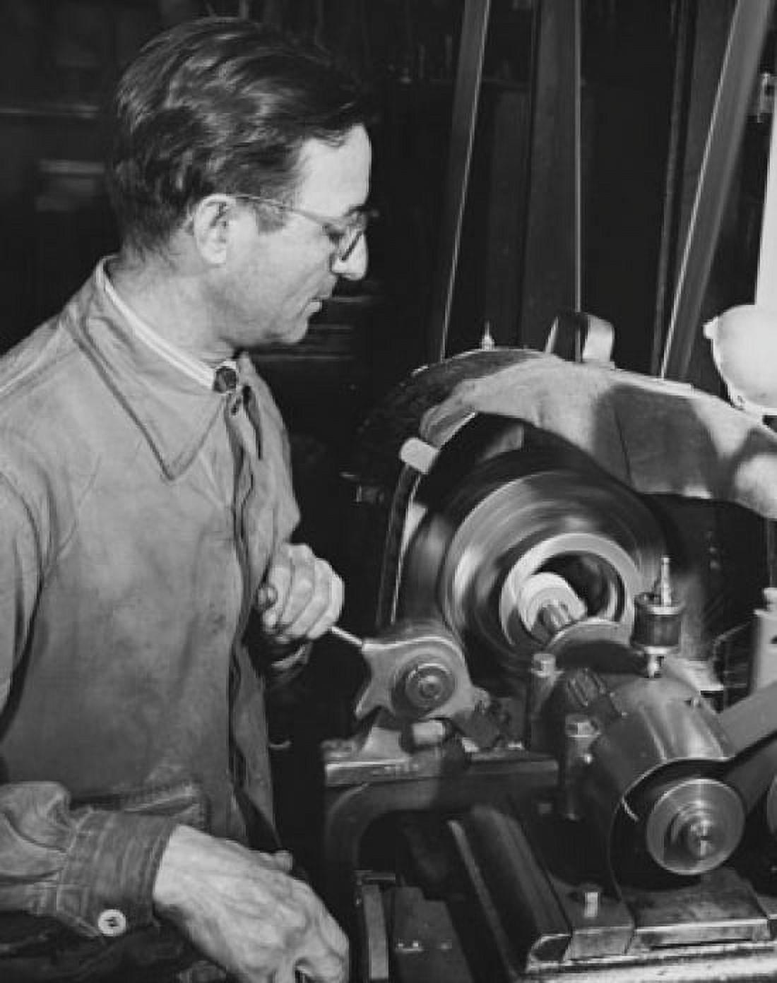 Side profile of a senior man working on a machine in a factory Canvas Art - (24 x 36)