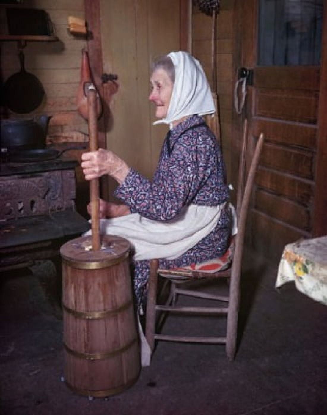 Side profile of a senior woman sitting and churning butter Canvas Art - (18 x 24)