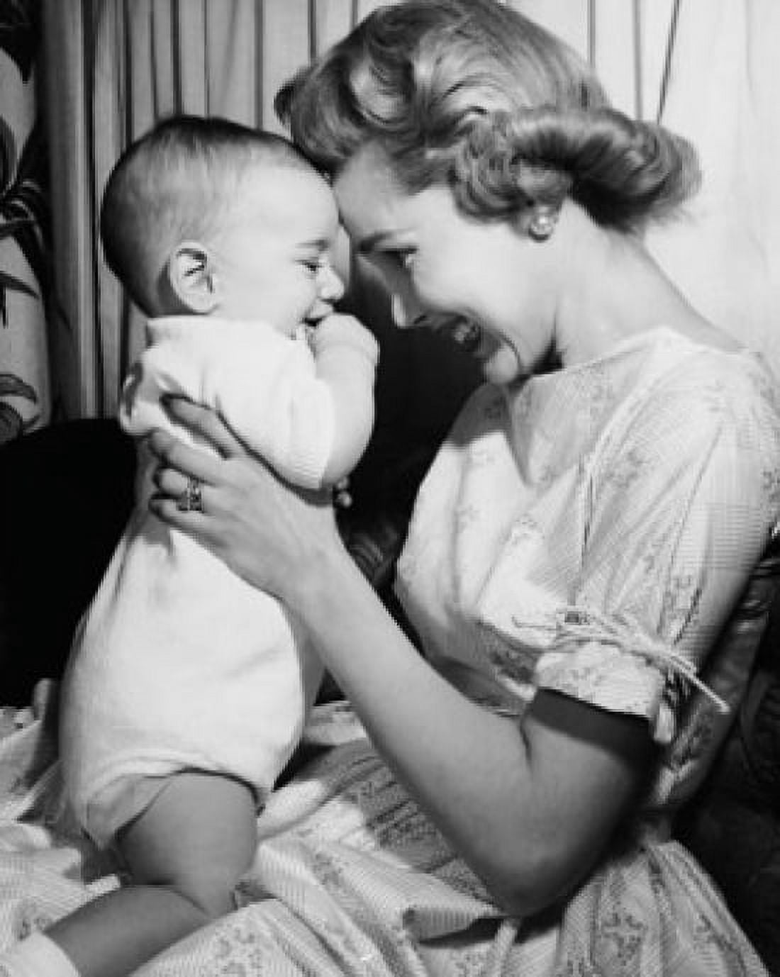 Side profile of a smiling mother with her baby Canvas Art - (24 x 36)