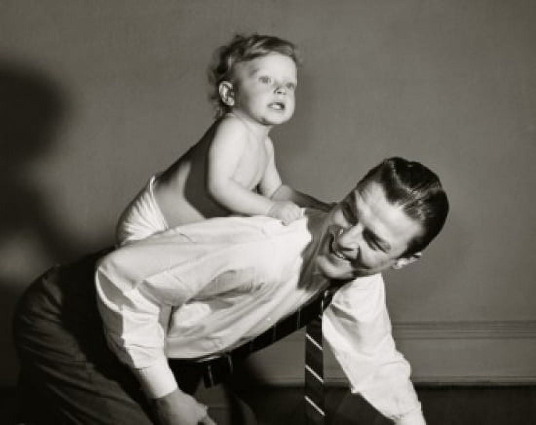 Side profile of a son riding on his fathers back Canvas Art - (24 x 36)