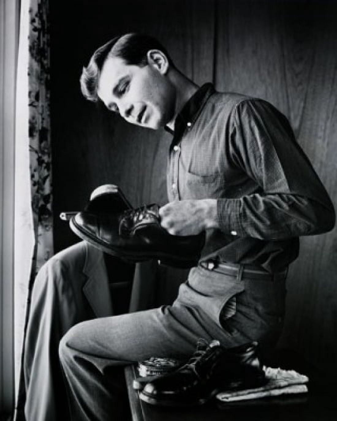Side profile of a teenage boy polishing his shoes Canvas Art - (18 x 24)