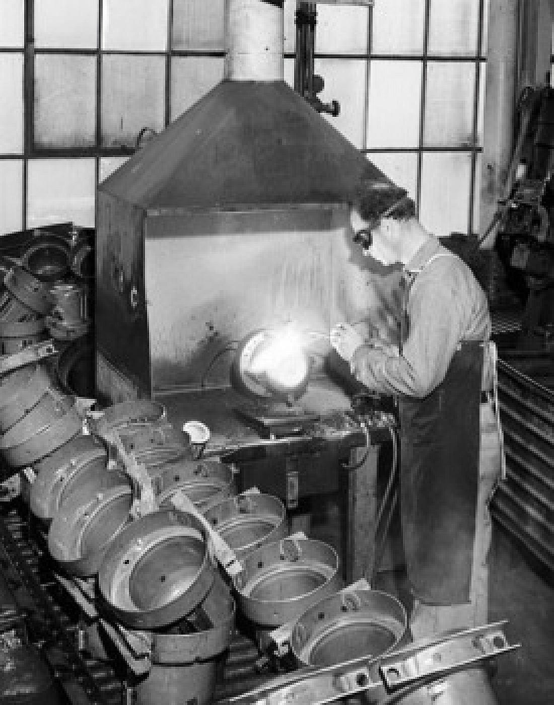 Side profile of a welder working with a welding torch in a factory Canvas Art - (24 x 36)