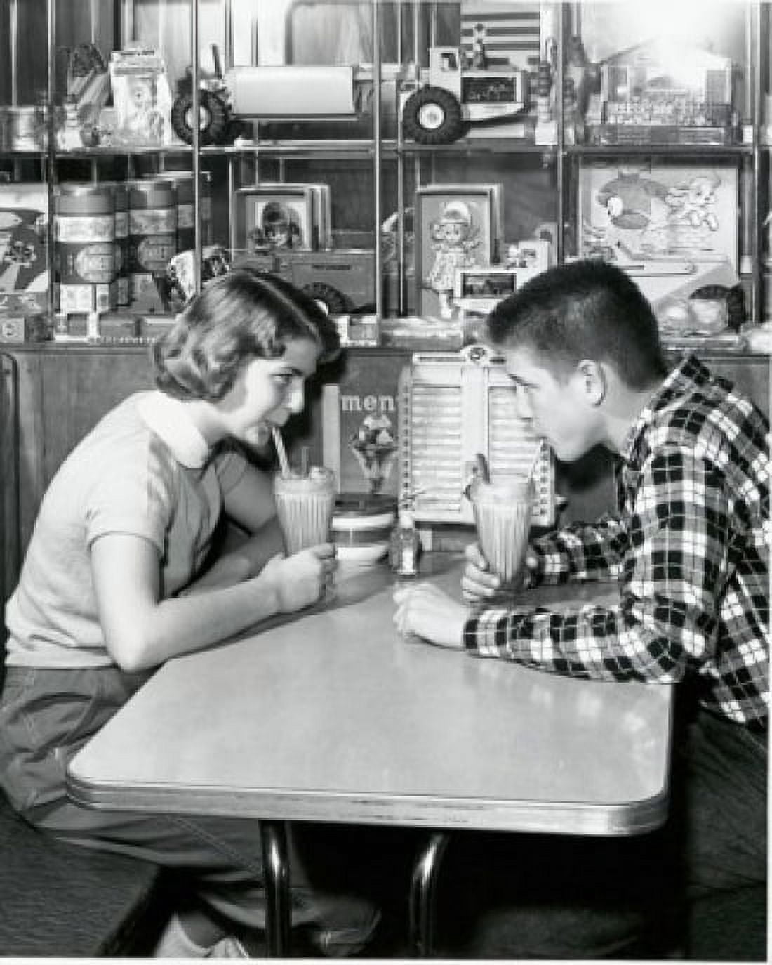 Side profile of a young couple drinking a milkshake in a restaurant 1954 Canvas Art - (24 x 36)