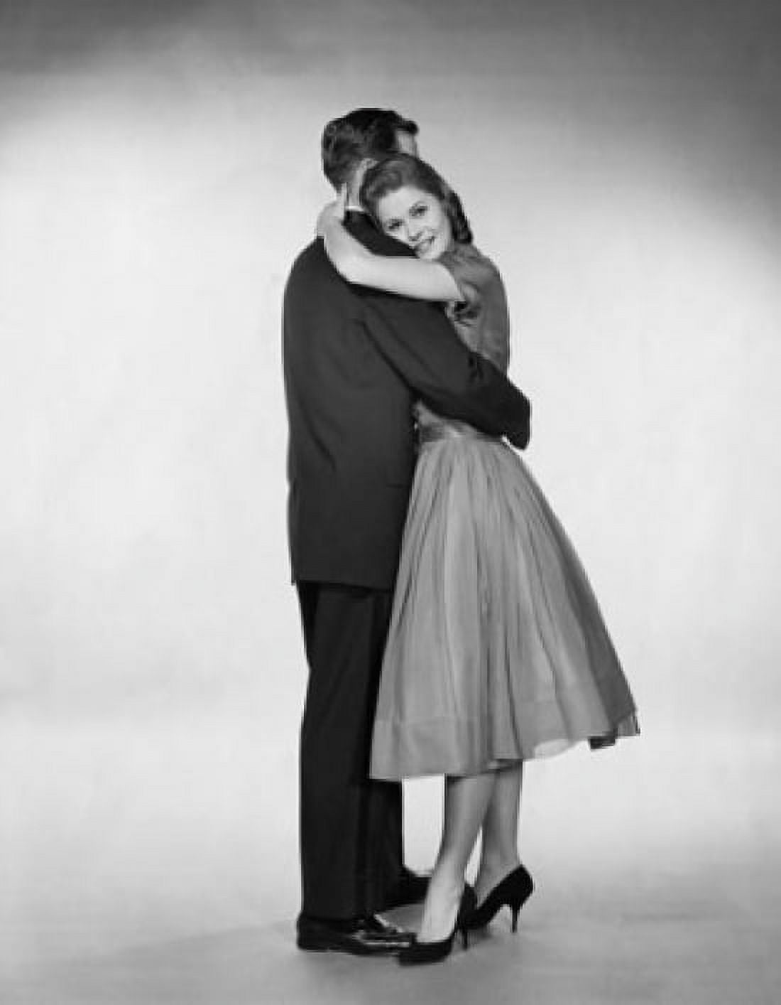 Side profile of a young couple embracing Canvas Art - (18 x 24)
