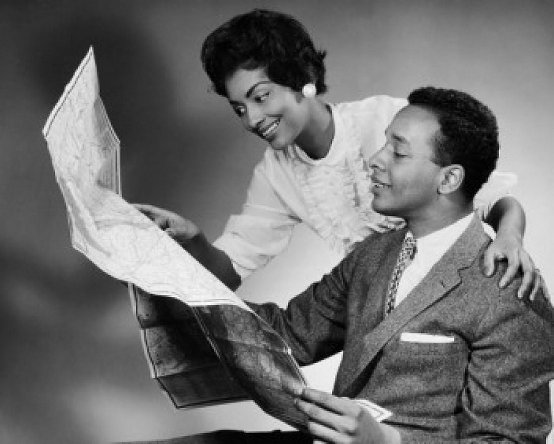 Side profile of a young couple reading a map Canvas Art - (18 x 24)