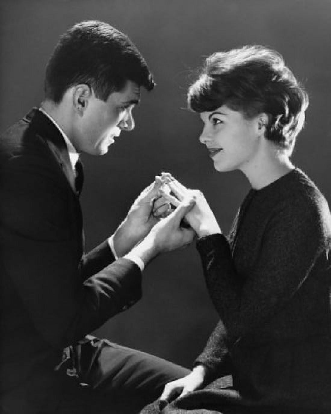Side profile of a young man putting a ring on a young womans finger Canvas Art - (18 x 24)