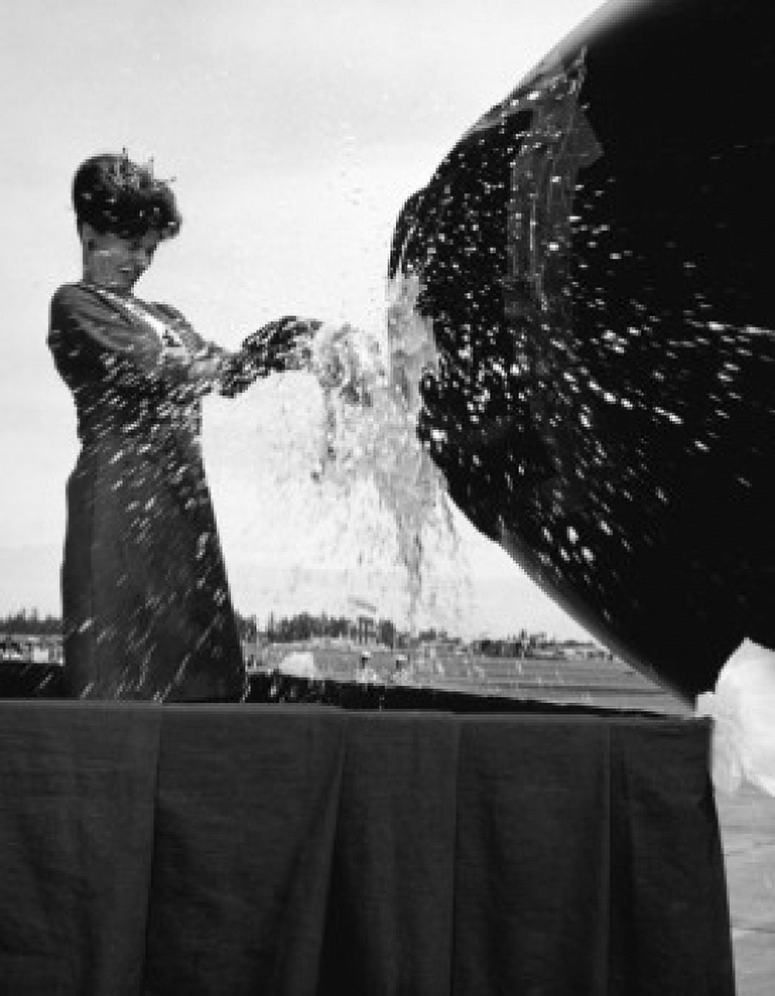 Side profile of a young woman breaking a champagne bottle at an airplane inauguration 1966 Canvas Art -  (18 x 24)