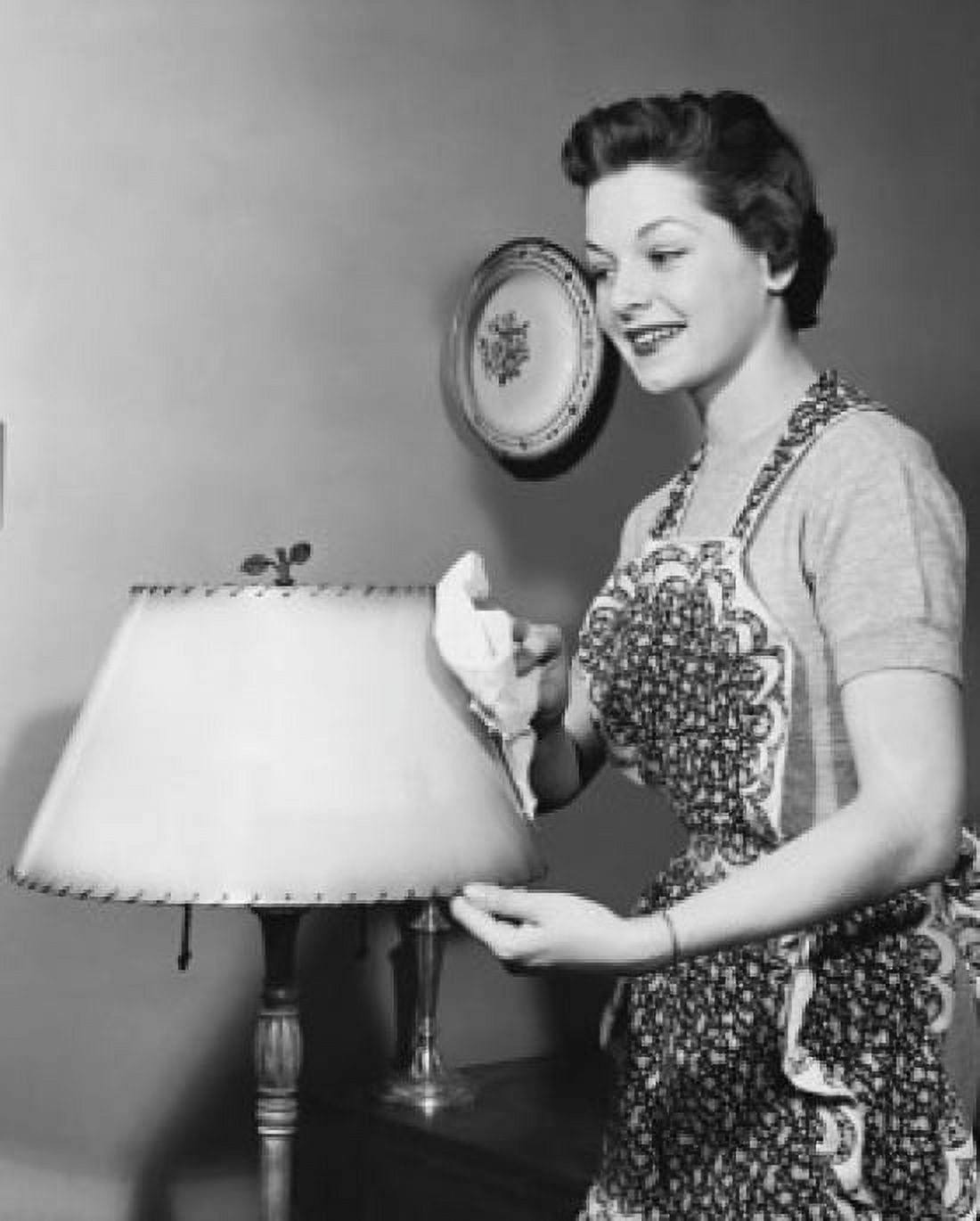 Side profile of a young woman cleaning a lamp shade Canvas Art - (18 x 24)