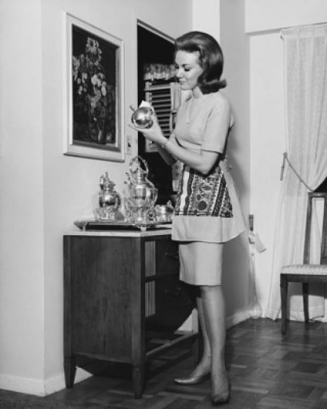 Side profile of a young woman cleaning a silver tea set Canvas Art - (18 x 24)