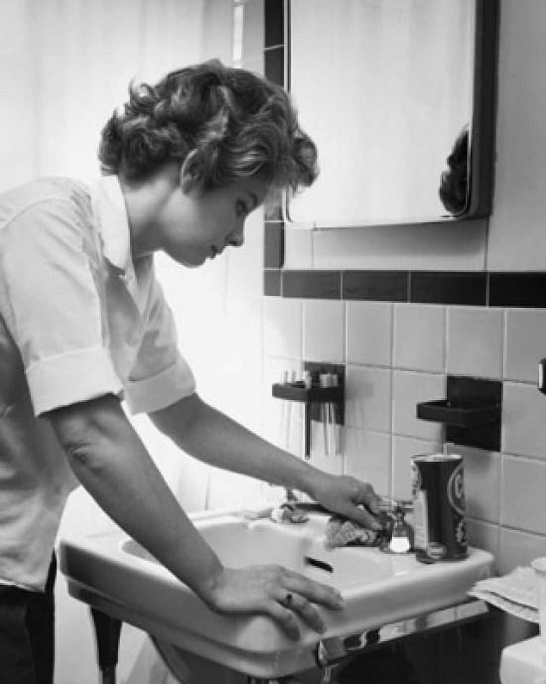 Side profile of a young woman cleaning the bathroom sink Canvas Art - (18 x 24)
