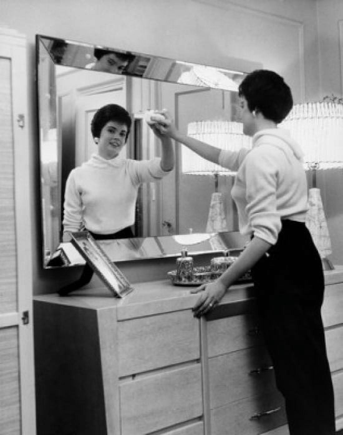 Side profile of a young woman cleaning the mirror of a dressing table Canvas Art - (18 x 24)